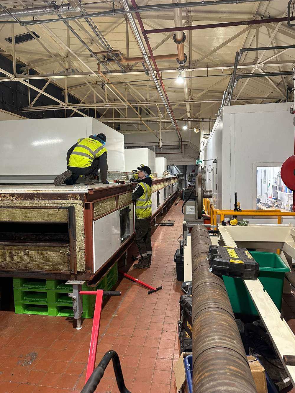 FABtekk engineers working on the stripped oven structure