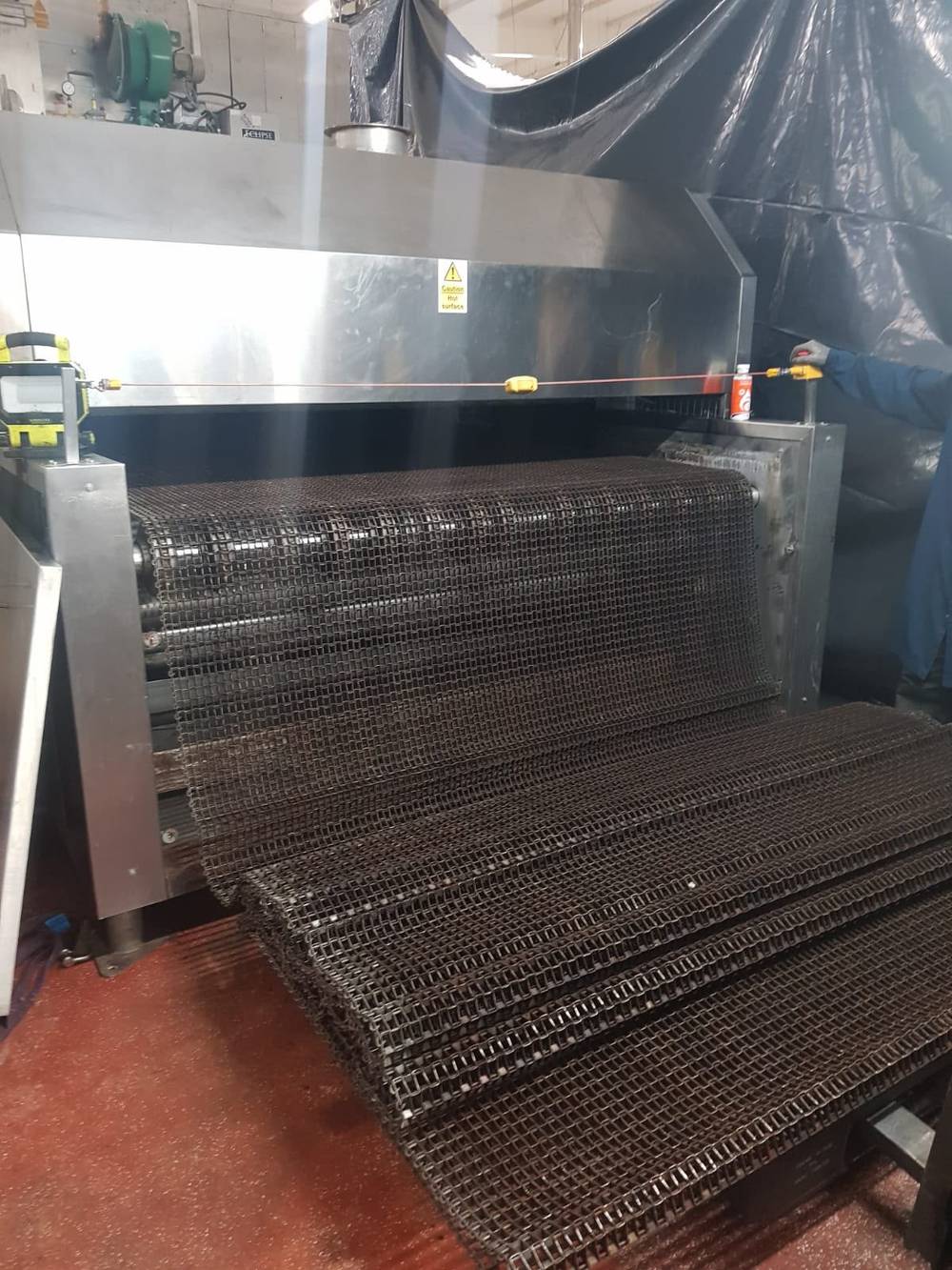 New oven band being fed into the oven
