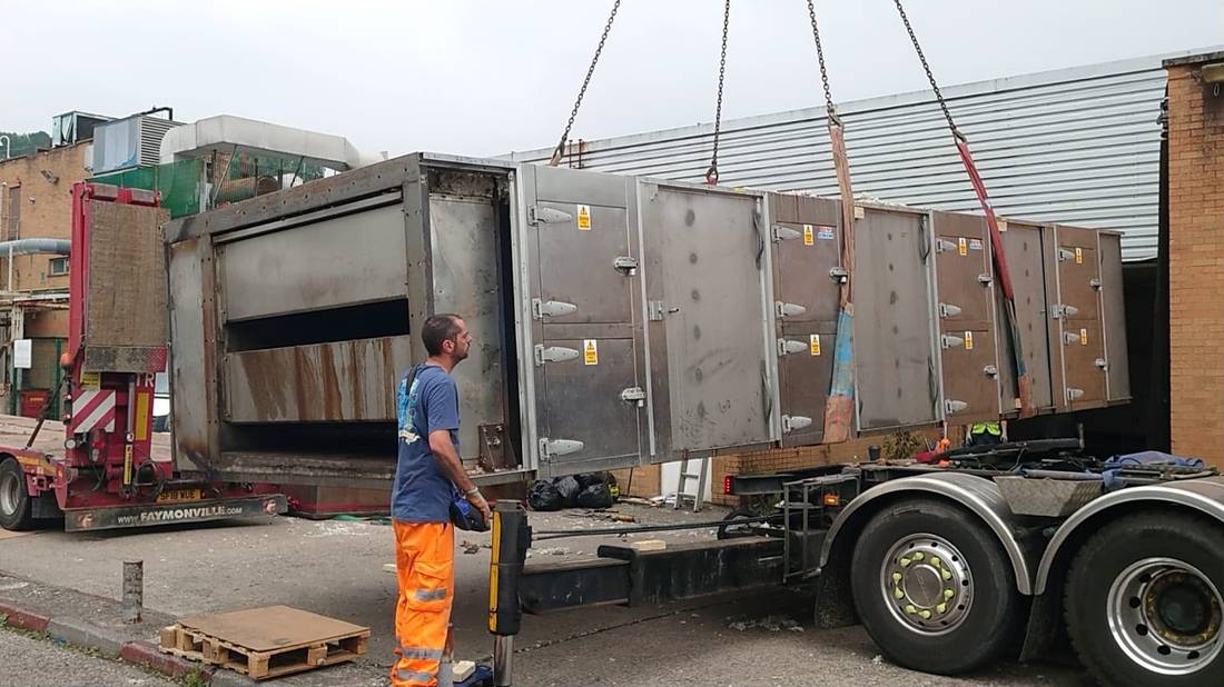 Oven section being loaded onto a low loader trailer